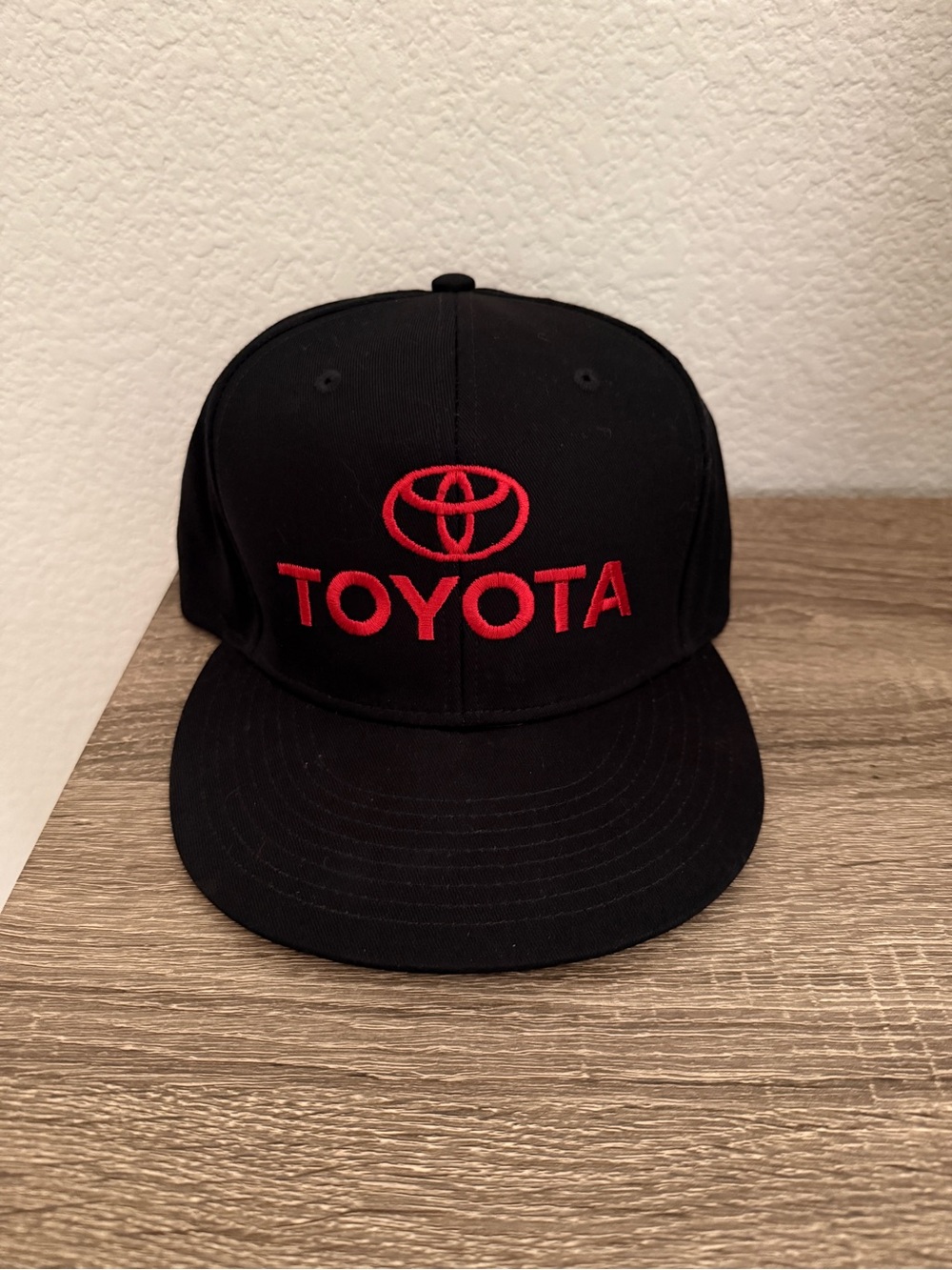 Black Toyota Hat with Red Lettering